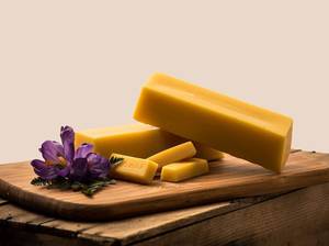 Beeswax Bricks on cutting board
