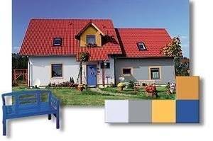 Freistehendes Haus in warmem Gelb mit Blau und Grau