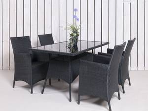 Rattan Gartenmöbel 4 Stühle 1 Tisch mit Glasplatte in anthrazit mit Topfpflanze vor einem weißen Bretterzaun mit neutralem Fußboden
